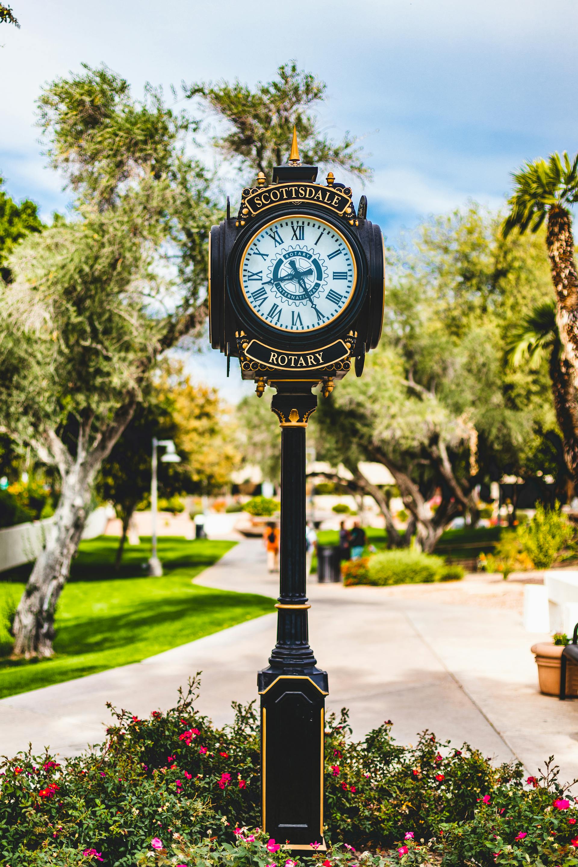 Scottsdale Arizona street clock and palm-lined walkway